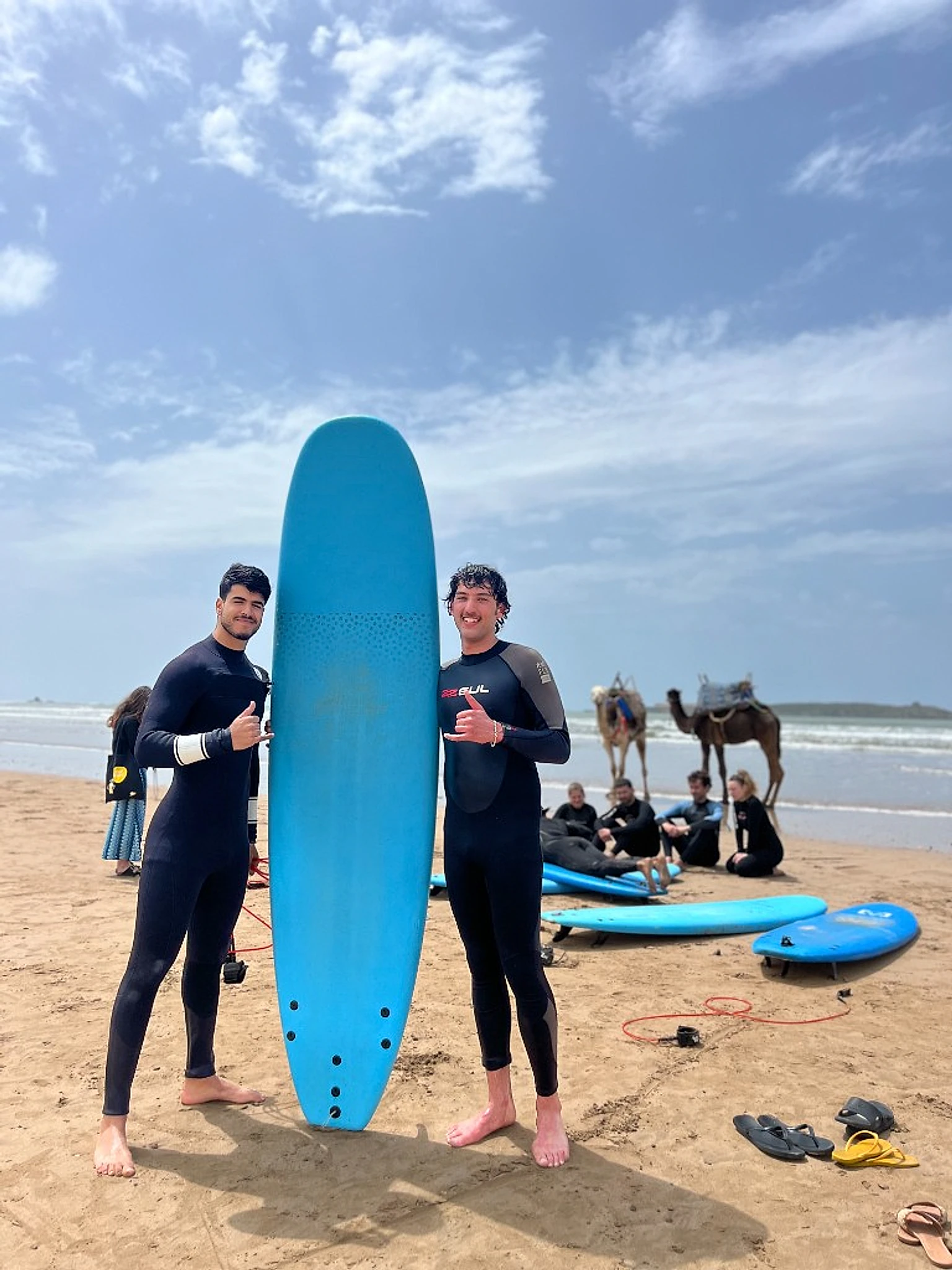 Surf students with boards on Essaouira beach — IKO school Atlantic Morocco